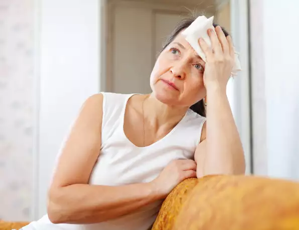 mature-woman-uses-handkerchief-head