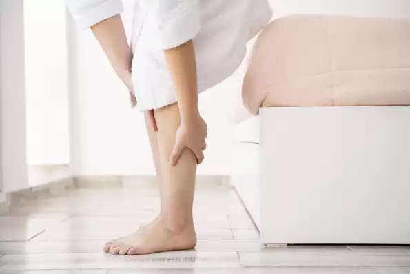 close-up-hands-massaging-legs